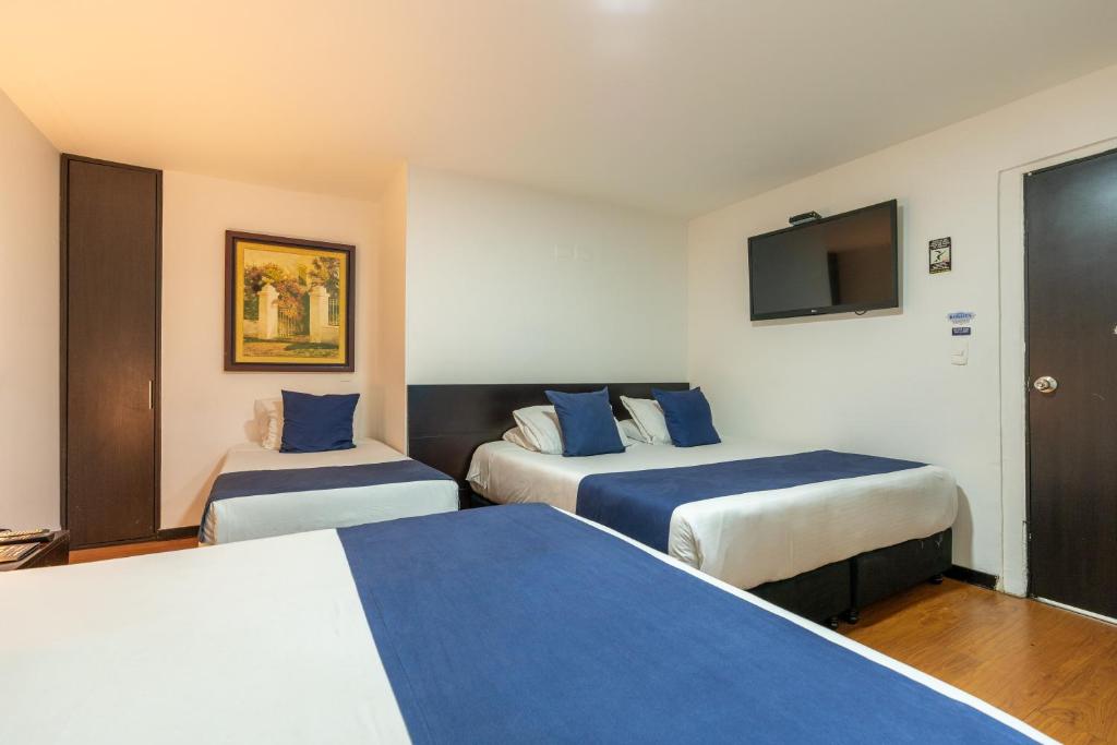 Postel nebo postele na pokoji v ubytování Hotel Bogota Resort