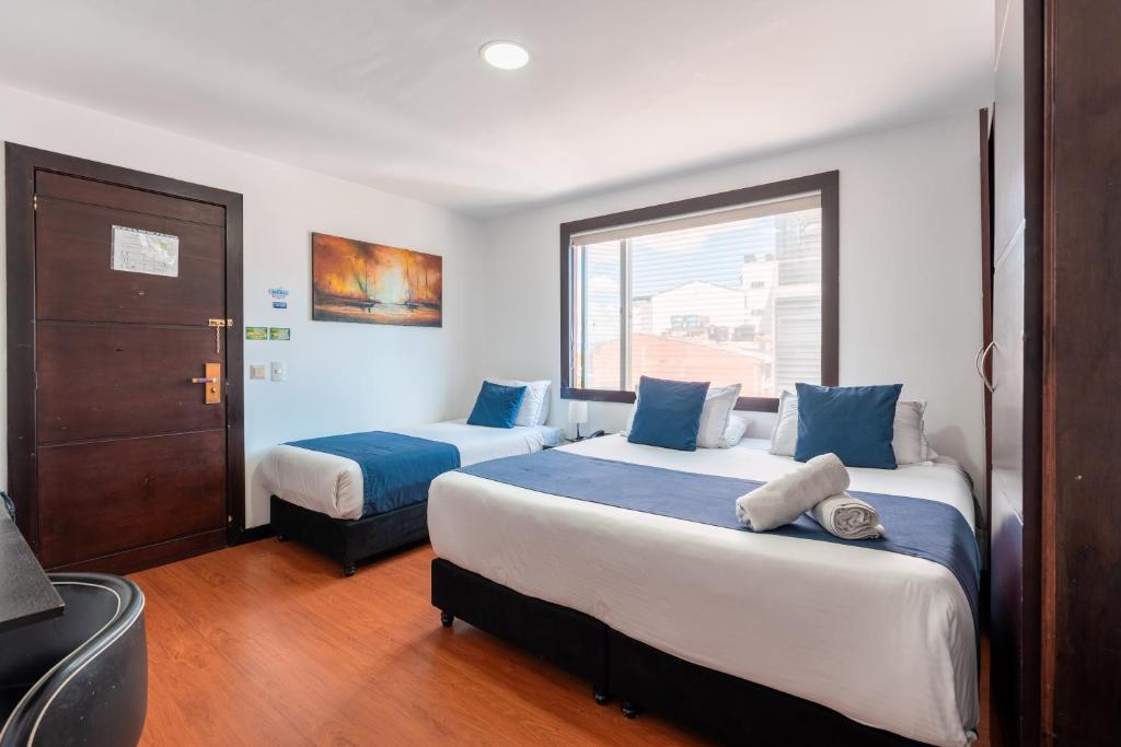 Postel nebo postele na pokoji v ubytování Hotel Bogota Resort