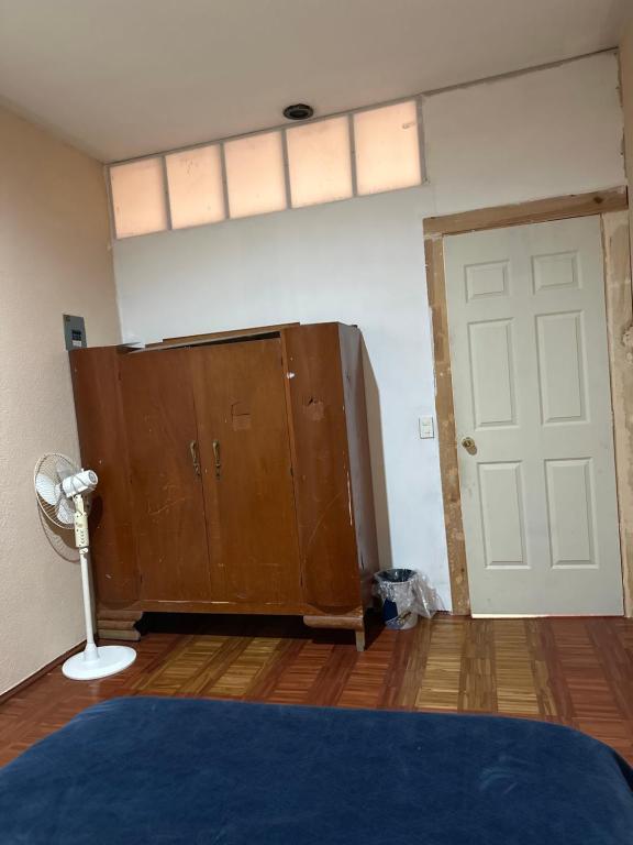 En eller flere senge i et værelse på Casa Yolcatl