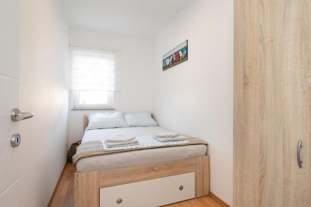 Posteľ alebo postele v izbe v ubytovaní Tom's House Njivice