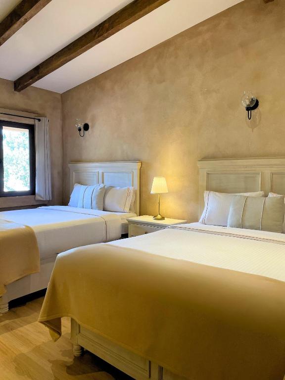 Postel nebo postele na pokoji v ubytování Hotel Pietro Santo