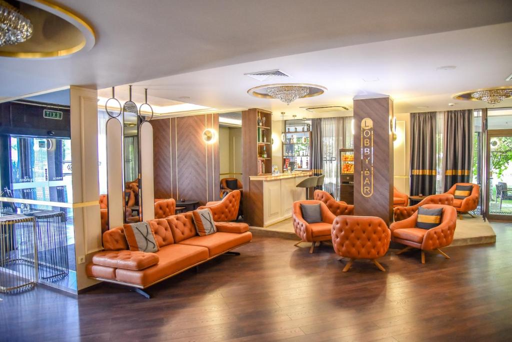 a lobby with couches and chairs and a salon at Park Hotel Plovdiv in Plovdiv