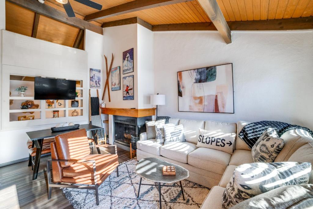 a living room with a couch and a fireplace at Chic Greek Peak Ski Resort Townhome with Balconies in Cortland