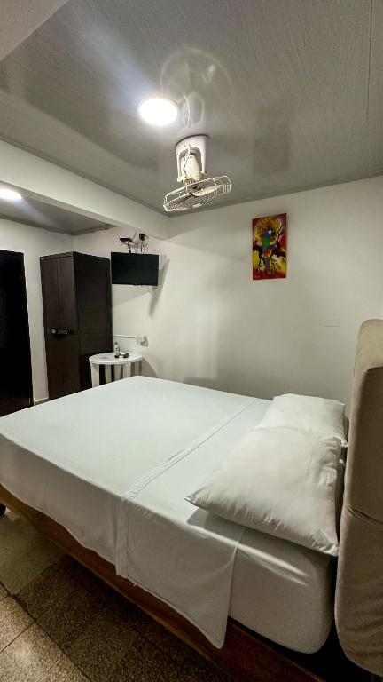 Postel nebo postele na pokoji v ubytování BOUTIQUE HOTEL BALOP Valledupar