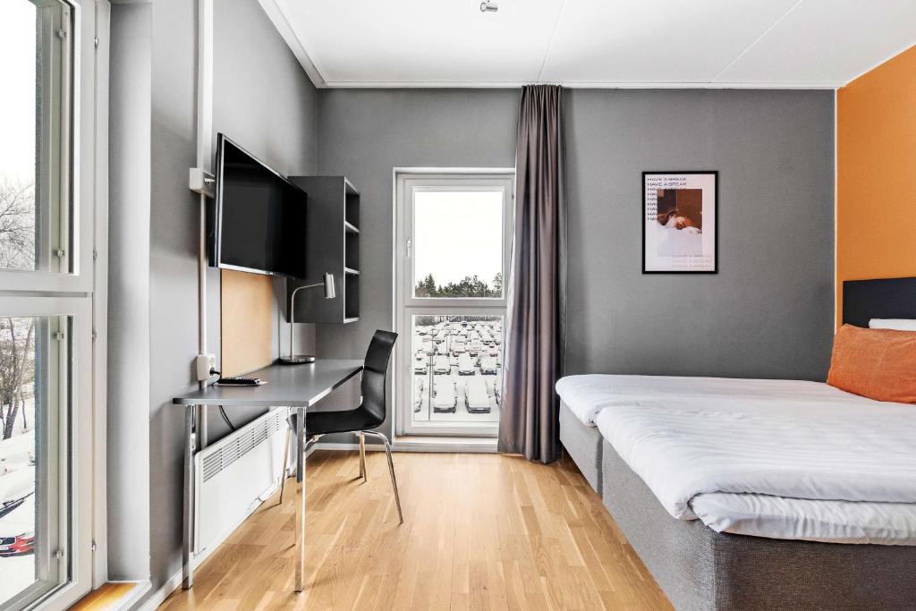 A bed or beds in a room at Aiden by Best Western Stockholm Arlanda Airport