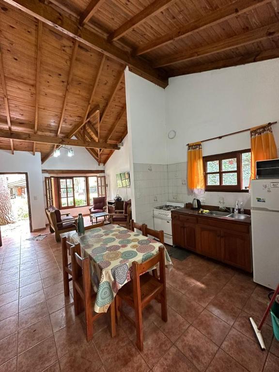 a kitchen with a table and chairs and a kitchen with a counter at OKIN 2 in Costa del Este