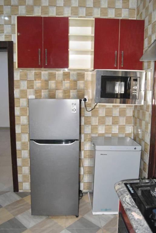 Kuchyň nebo kuchyňský kout v ubytování Ibadan Serviced Apartments
