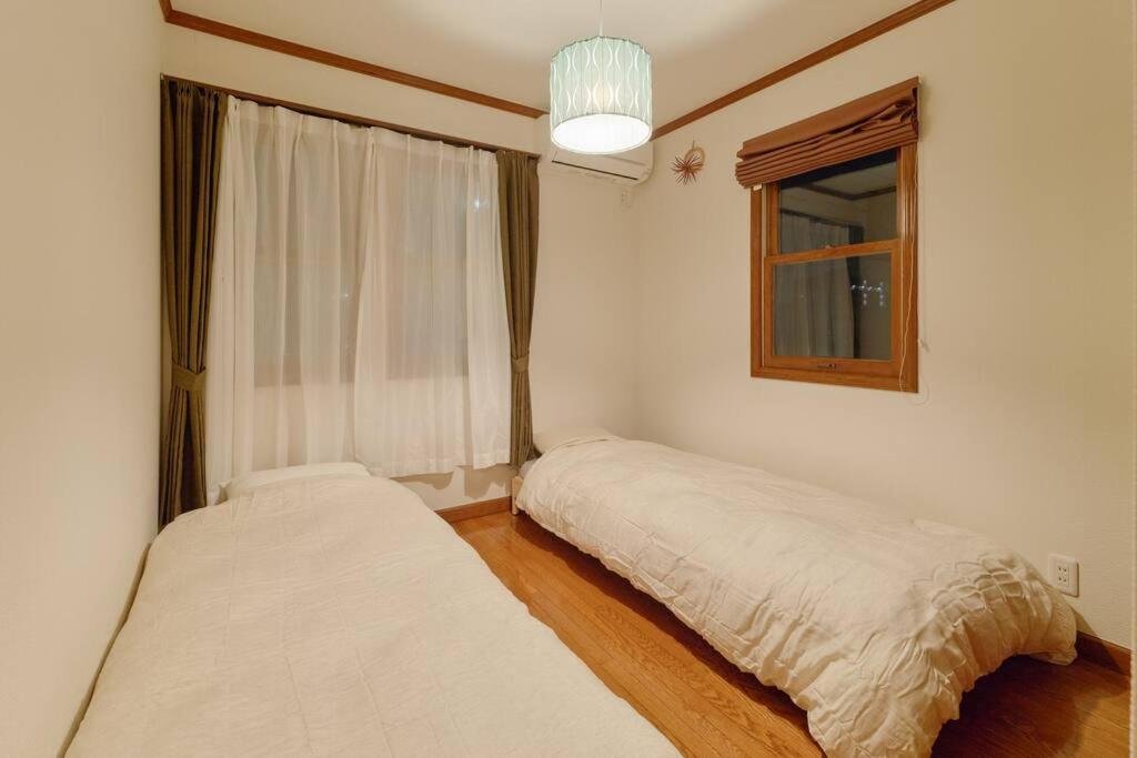 Postel nebo postele na pokoji v ubytování 1棟貸切BBQ可 本格ダーツ かき氷機 Villa上条