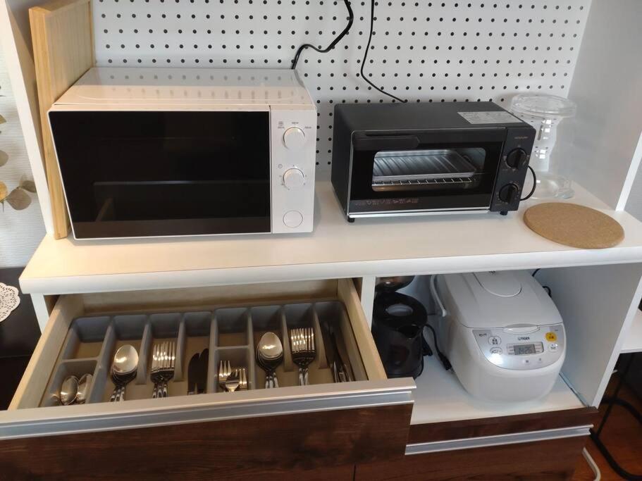 Kuchyň nebo kuchyňský kout v ubytování 1棟貸切BBQ可 本格ダーツ かき氷機 Villa上条