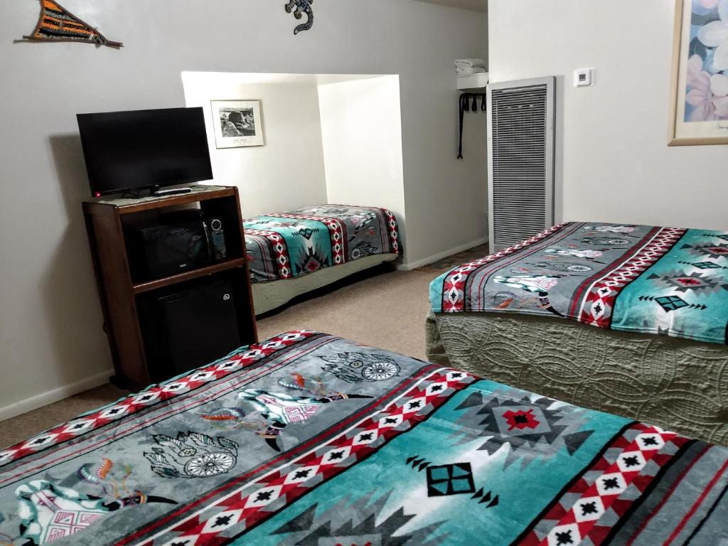 Postel nebo postele na pokoji v ubytování Mokee Motel