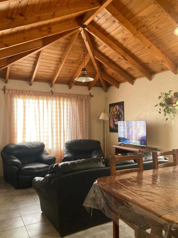 a living room with a couch and a table at Casa Nelly 2 in Playa Unión