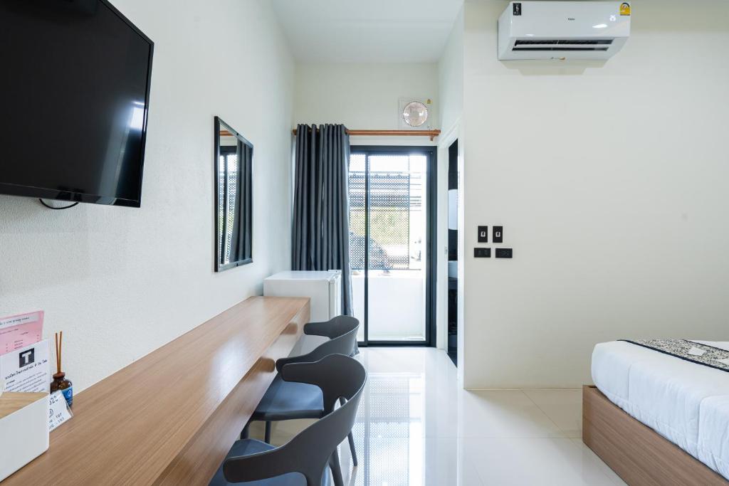 Postel nebo postele na pokoji v ubytování T-OneHome
