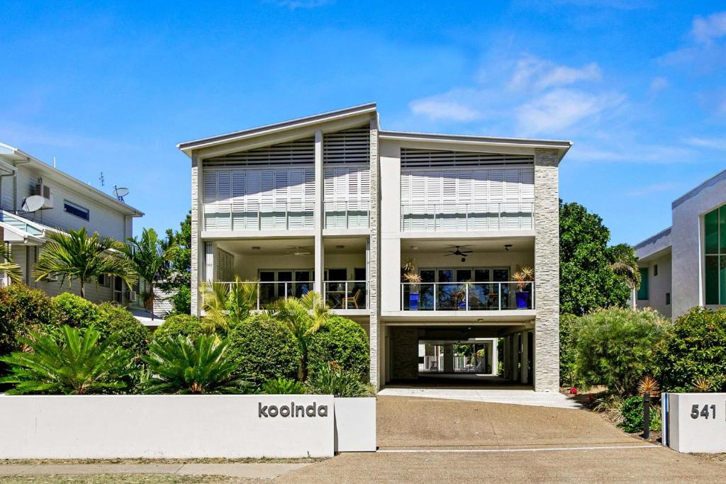 a large white building with a lot of windows at Beachfront Nirvana in Urangan