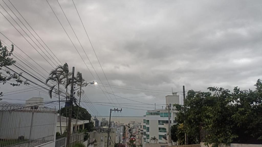 a view of a city with buildings and power lines at B & B HOSTEL Coqueiros in Florianópolis