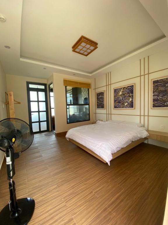Postel nebo postele na pokoji v ubytování AN PHÚ Home