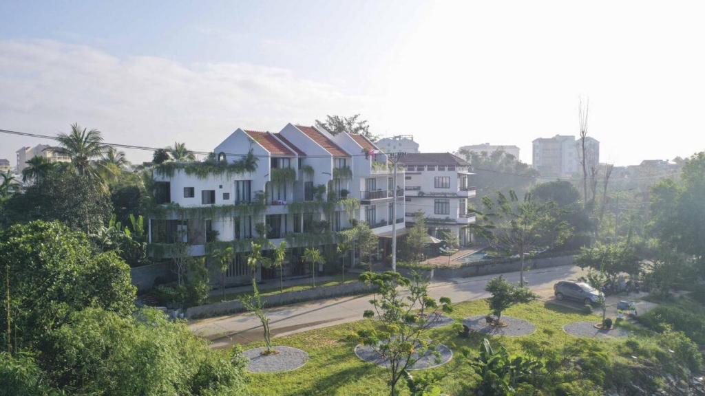 an aerial view of a building with a street at The Corner Riverside Villa in Hoi An