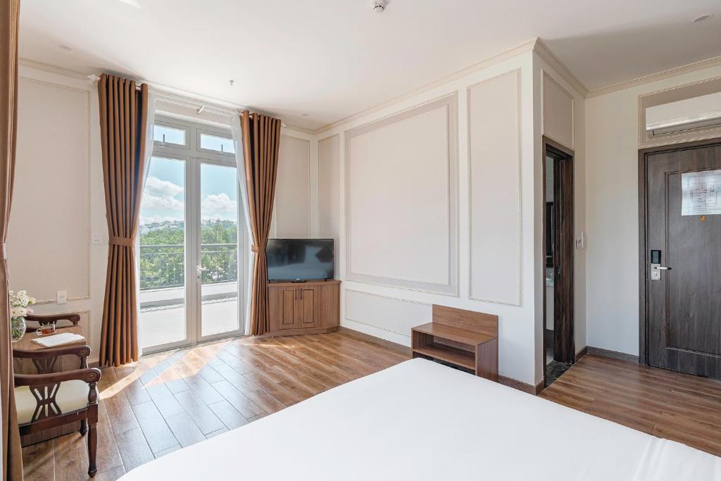 Postel nebo postele na pokoji v ubytování PINE VIEW Hotel Dalat