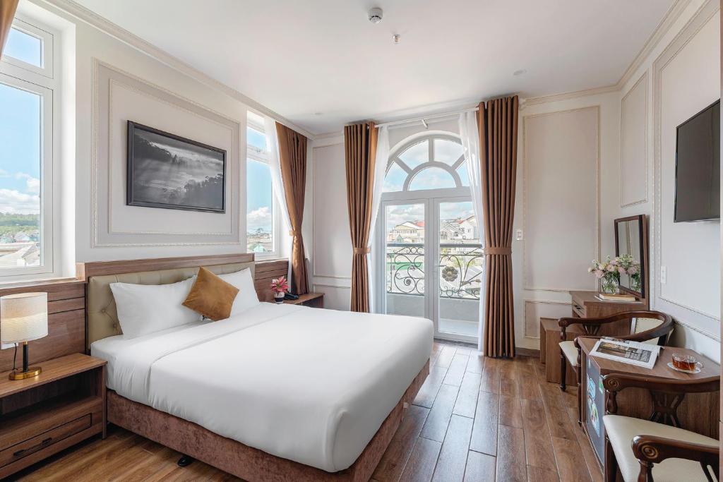 Postel nebo postele na pokoji v ubytování PINE VIEW Hotel Dalat