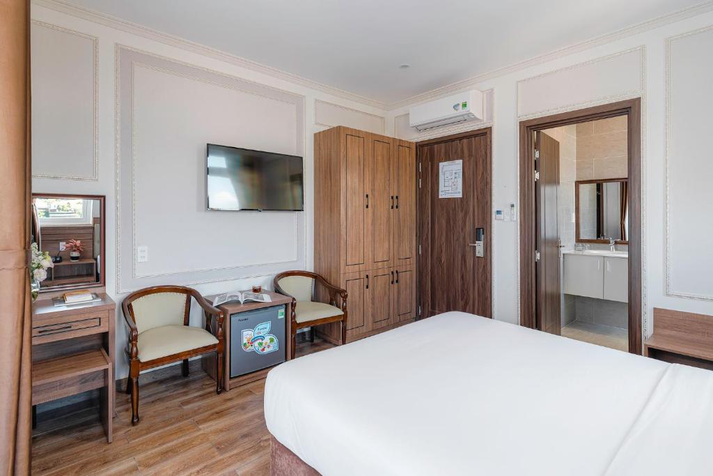 Postel nebo postele na pokoji v ubytování PINE VIEW Hotel Dalat
