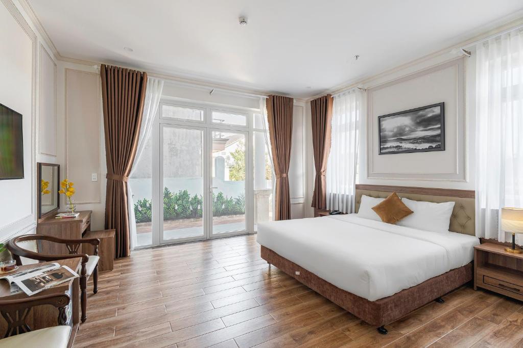 Postel nebo postele na pokoji v ubytování PINE VIEW Hotel Dalat