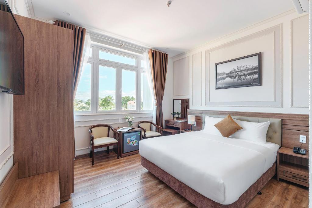 Postel nebo postele na pokoji v ubytování PINE VIEW Hotel Dalat
