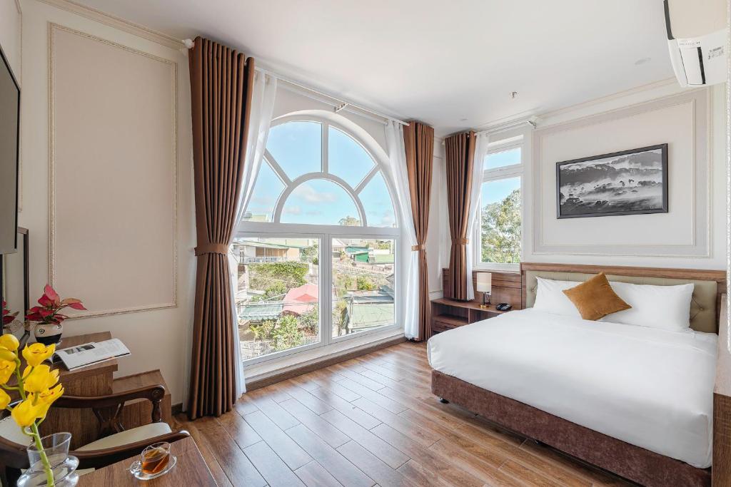 Postel nebo postele na pokoji v ubytování PINE VIEW Hotel Dalat