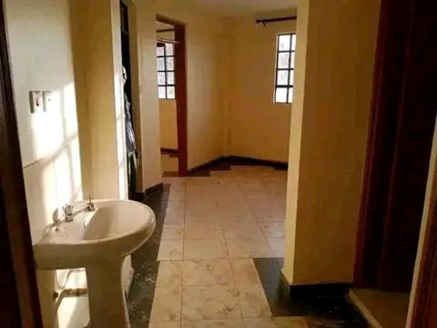 a bathroom with a toilet and a sink at Safaris hotels in Nairobi
