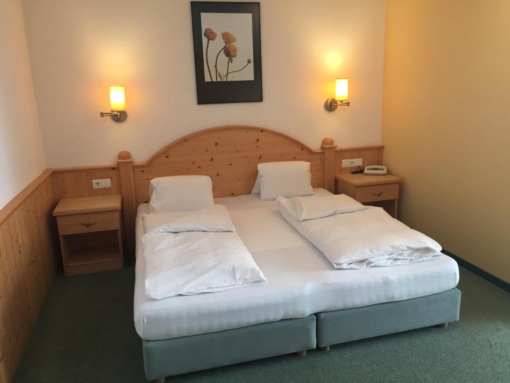 Postel nebo postele na pokoji v ubytování Hotel Pütia