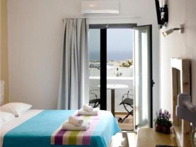 Postel nebo postele na pokoji v ubytování OMIROS HOTEL