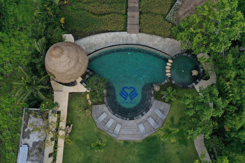 an overhead view of a swimming pool in a resort at Lalasa Villas Canggu in Canggu