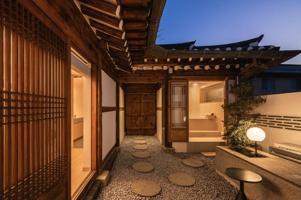 a hallway of a house with a walkway at Luxury hanok with private bathtub - SN18 in Seoul