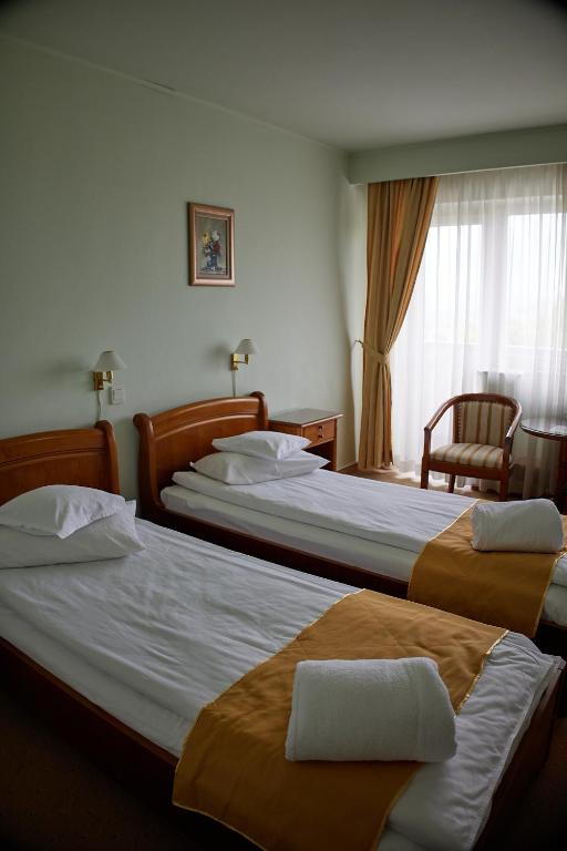 Postel nebo postele na pokoji v ubytování Hotel Belvedere