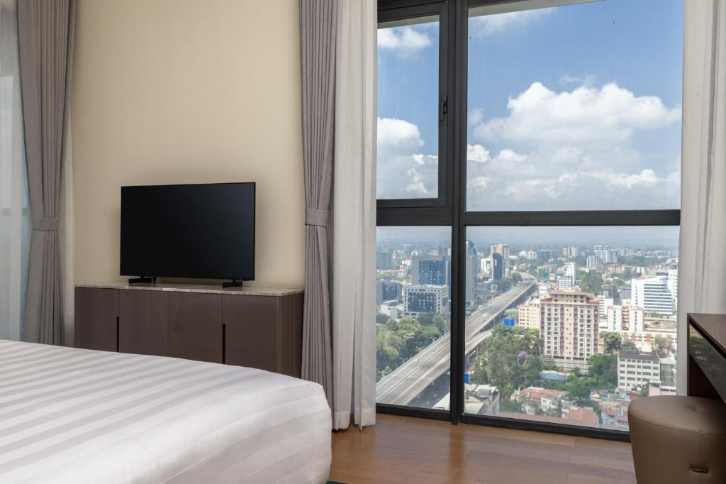 TV a/nebo společenská místnost v ubytování Pan Pacific Serviced Suites Nairobi