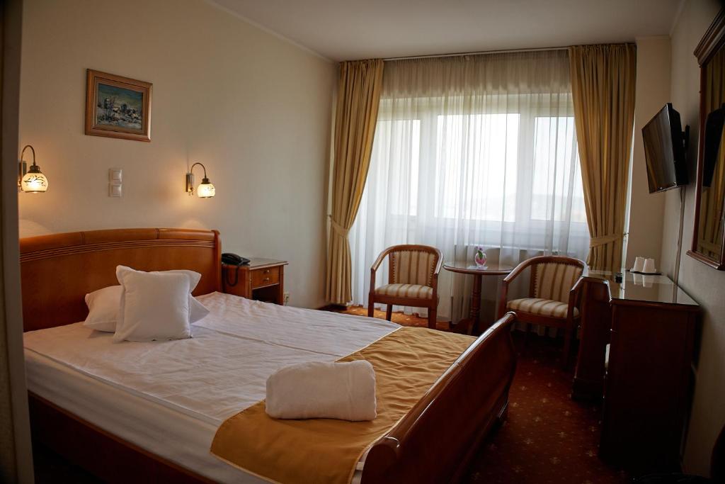 Postel nebo postele na pokoji v ubytování Hotel Belvedere