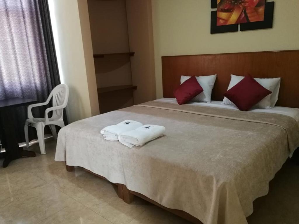 Postel nebo postele na pokoji v ubytování Hostal Aventura Total Perú_lunahuana