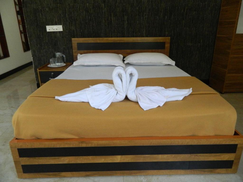 Postel nebo postele na pokoji v ubytování Torch Ginger Homestay