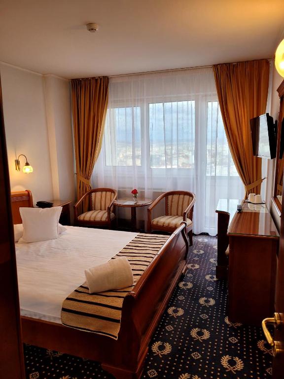 Postel nebo postele na pokoji v ubytování Hotel Belvedere