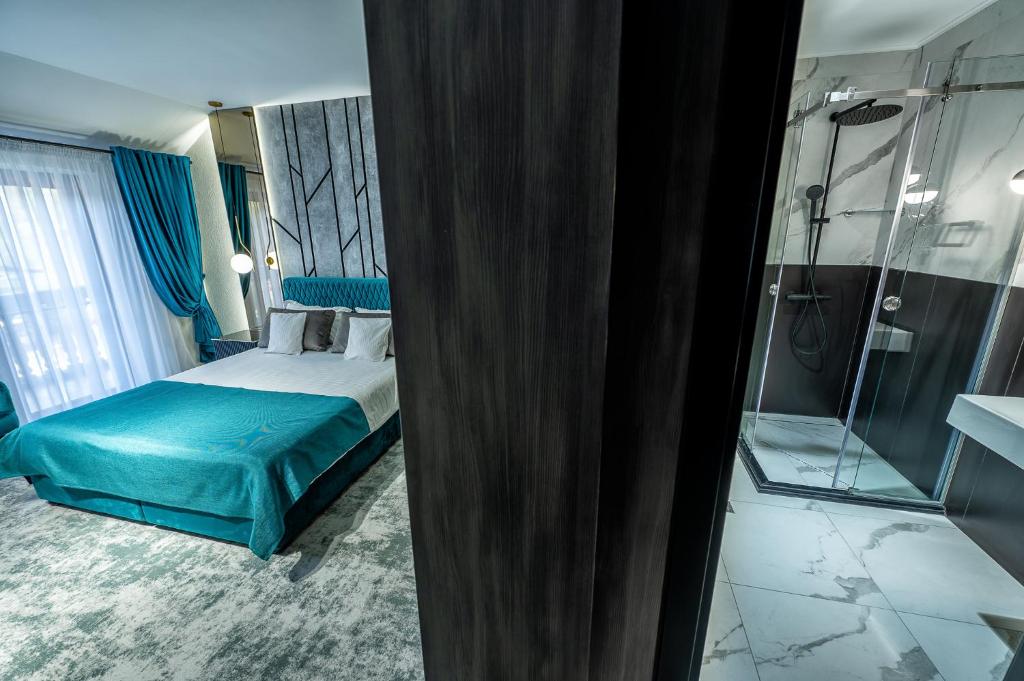 Postel nebo postele na pokoji v ubytování Complex Turistic Casa Romaneasca