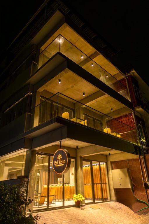 a large building with a sign in front of it at BEL VISTO in Vālpārai