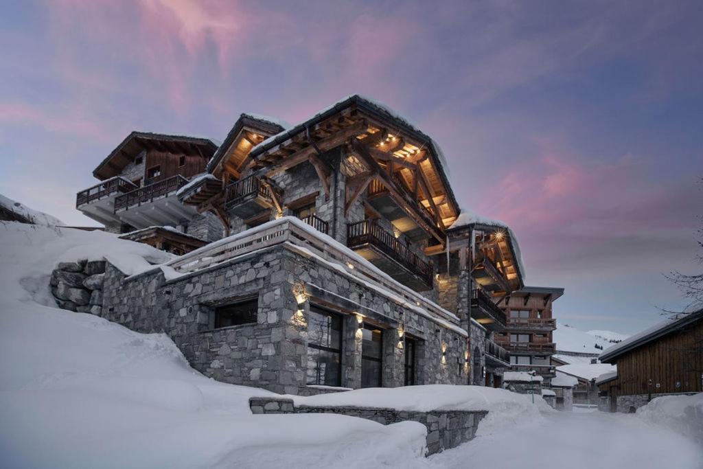 a building in the snow with snow around it at Chalet Eden Roc in Tignes
