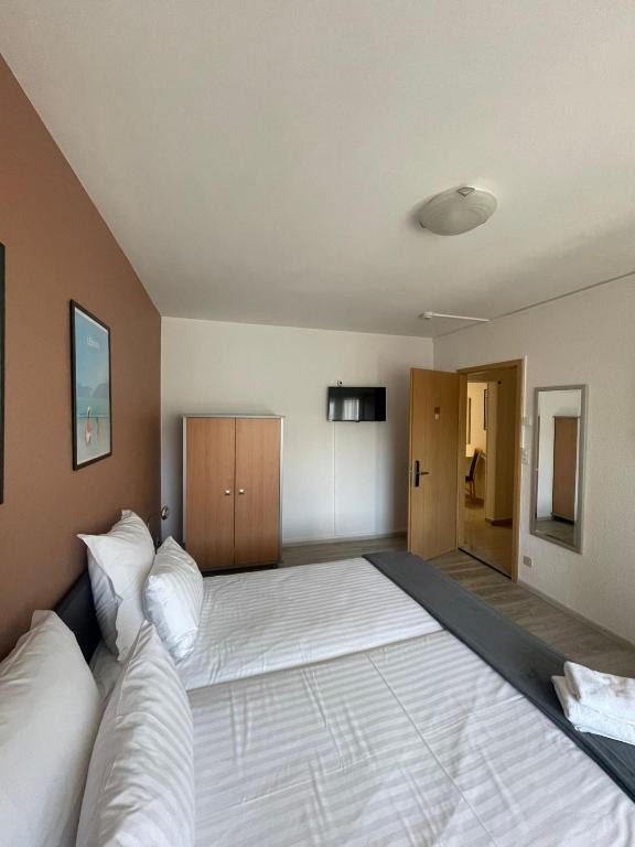 Postel nebo postele na pokoji v ubytování Primadom Aparthotel