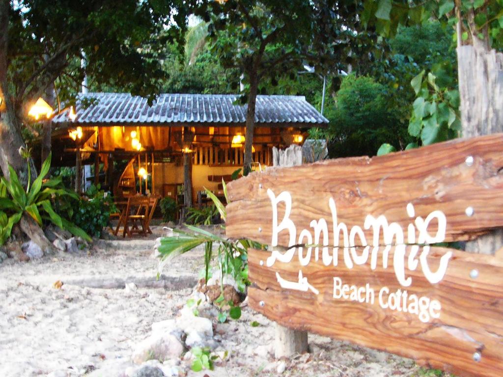 a wooden sign in front of a beach cottage at Room in Bungalow - Foresta Cottage of Koh Pu no6196 in Ko Jum