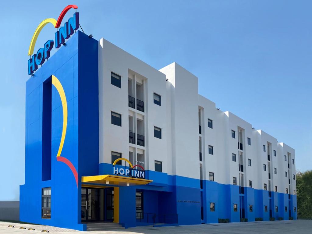 a rendering of a hotel with a houston inn at Hop Inn Suphanburi in Suphan Buri