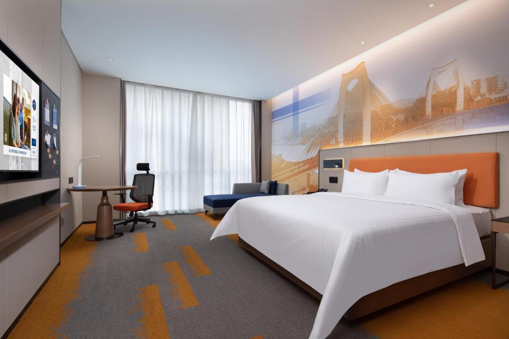 TV a/nebo společenská místnost v ubytování Hampton by Hilton Guigang