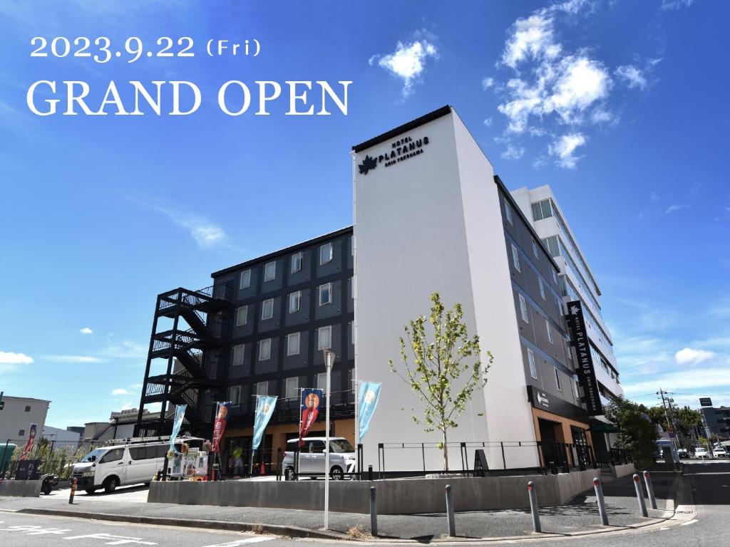 a rendering of a grand open building in a parking lot at ホテルプラタナス新横浜 in Yokohama