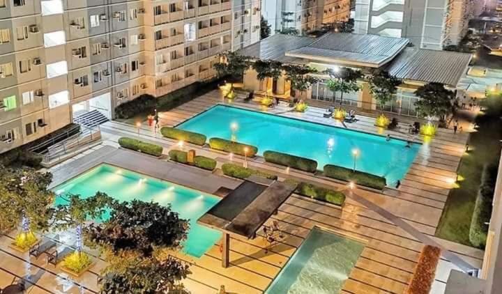 an overhead view of a swimming pool in a building at JAMAHSA CONDO STAYCATION TREES RESIDENCES NEAR SM FAIRVIEW in Manila