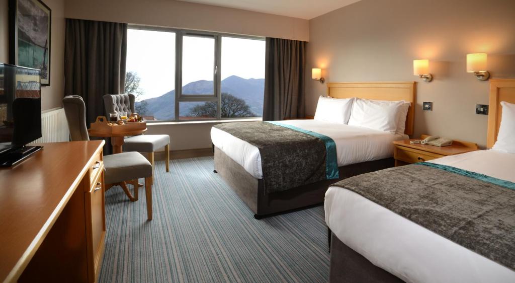 Postel nebo postele na pokoji v ubytování Hotel Killarney