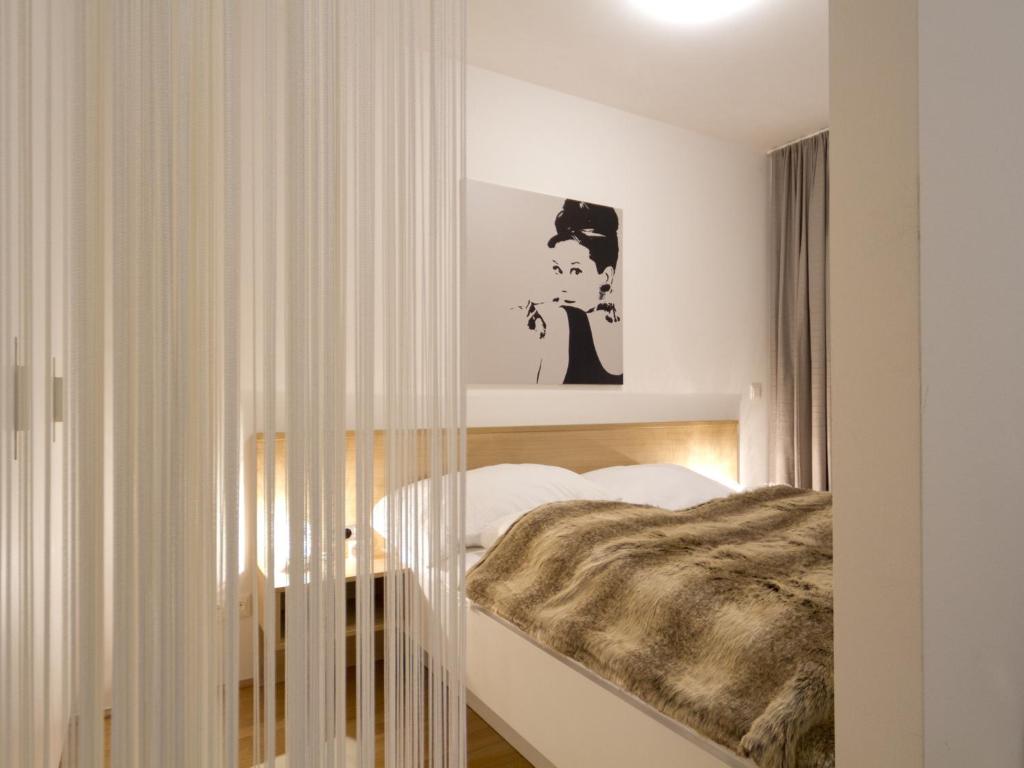Voodi või voodid majutusasutuse Balcony Dream Mariahilf Top 29 toas