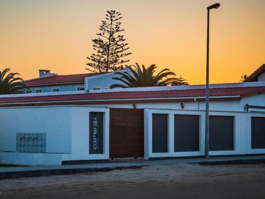 a building with a tree on top of it at Beach Garden Guesthouse with Self Catering in Swakopmund