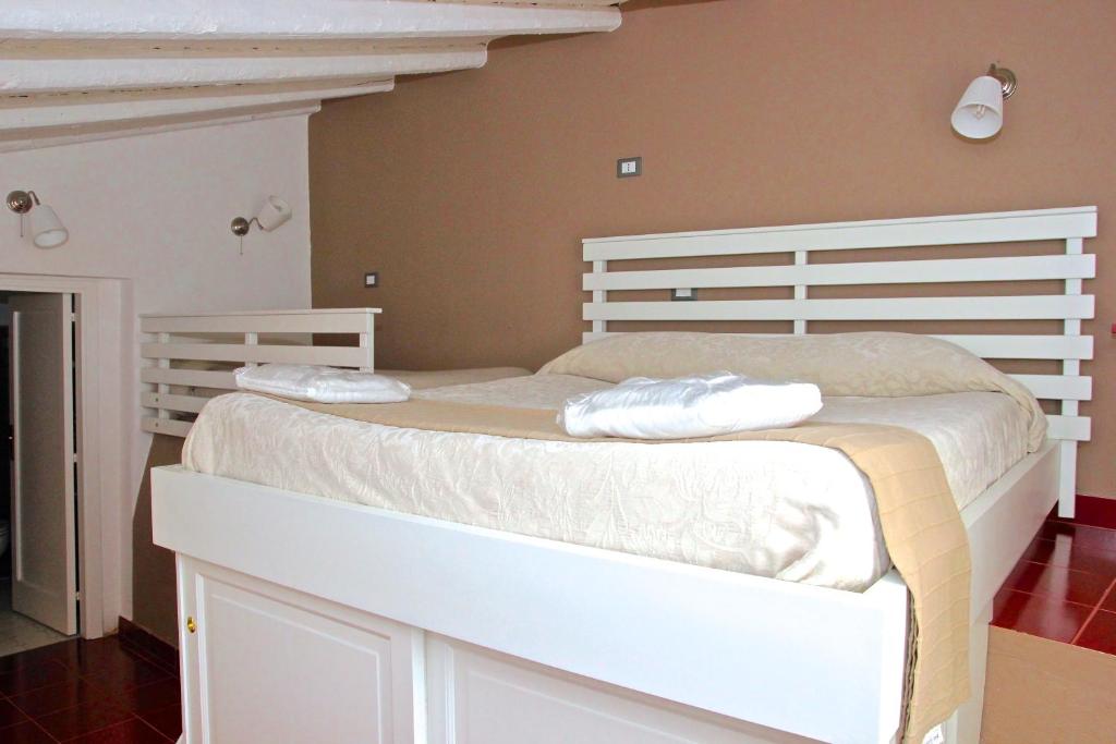 Postel nebo postele na pokoji v ubytování Agriturismo Roccadia